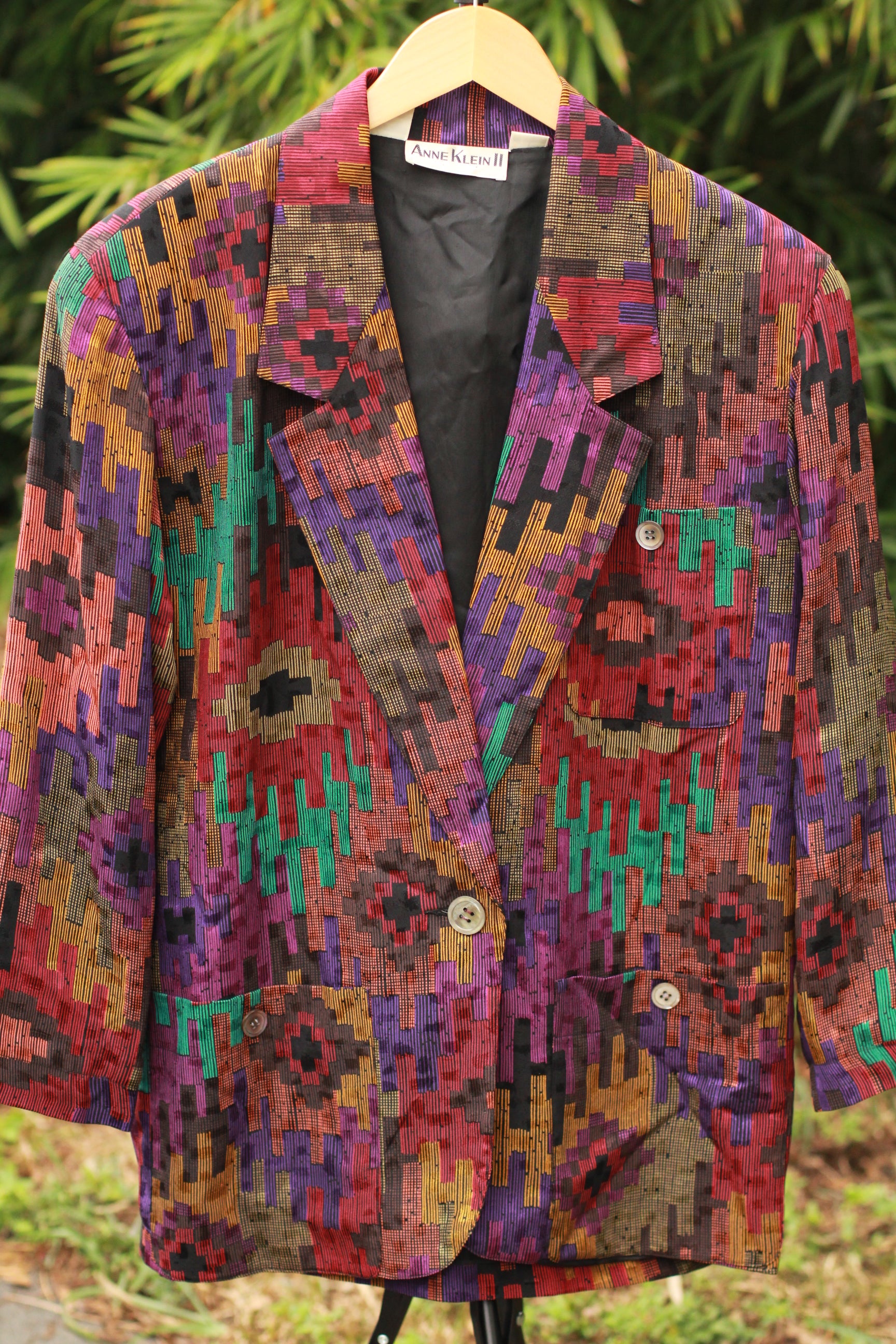 Front view of purple, orange, and turquoise patterned silk designer blazer