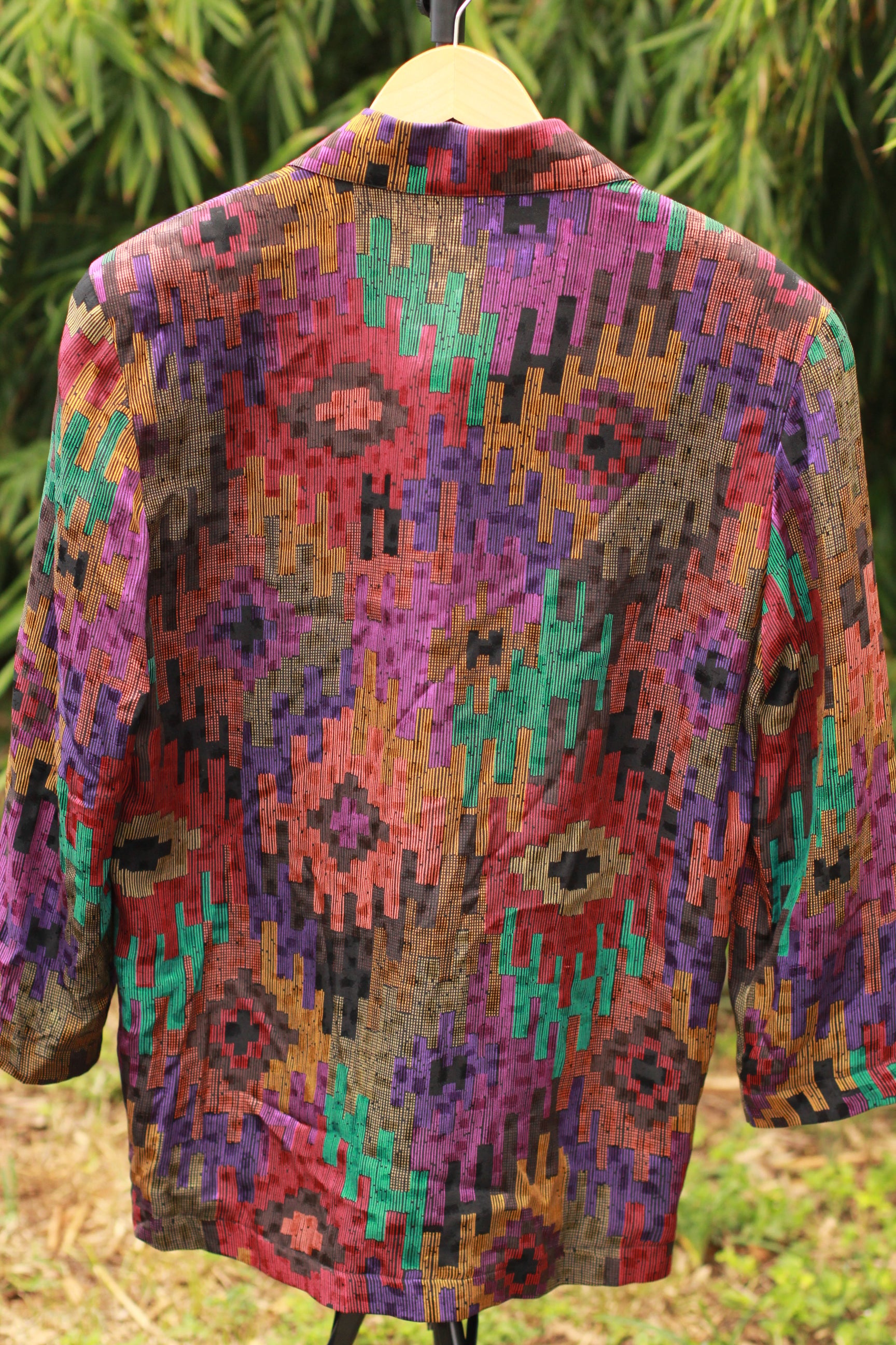Back view of multicolor silk blazer with geometric design