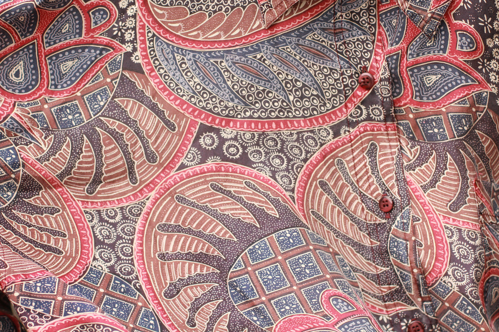 Close-up of buttons and paisley pattern on Cristina silk blouse