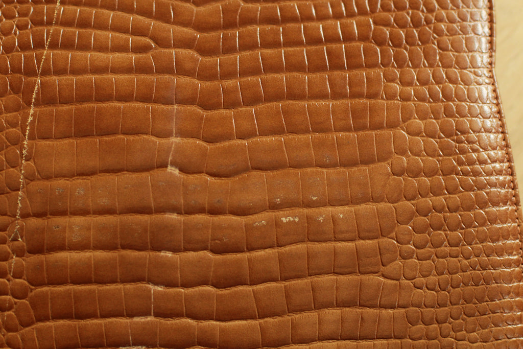 Close-up showing minor vintage marks on 1960s bag - back view