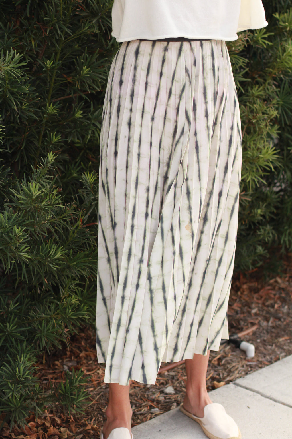 Full length front view — pleated silhouette, classic look