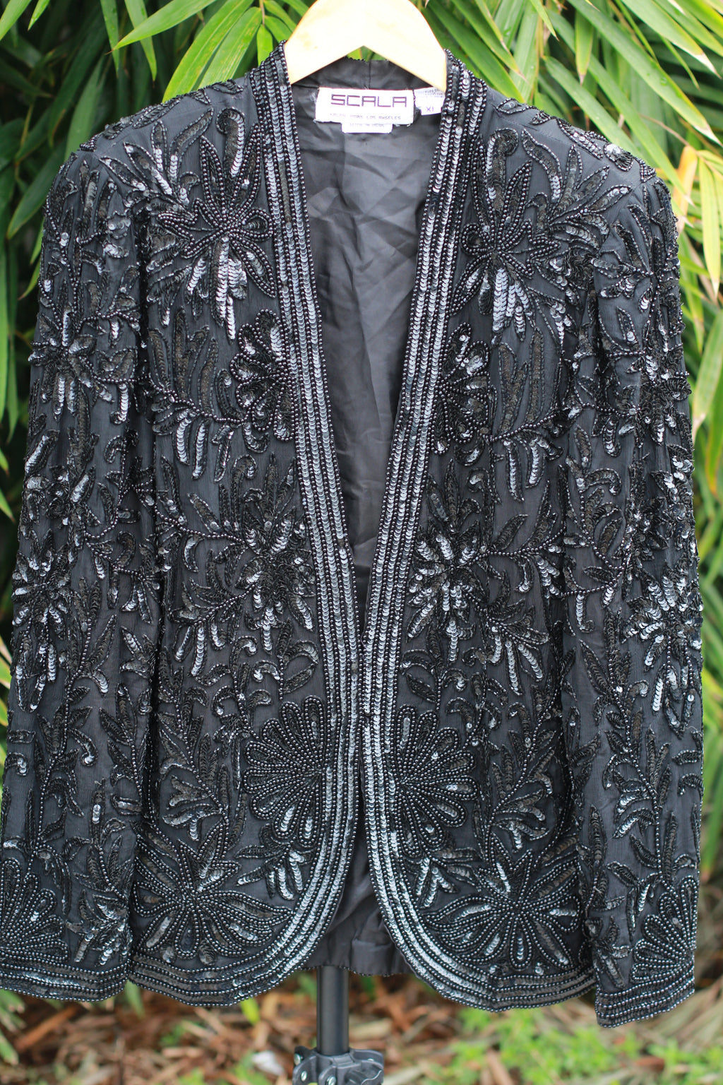 Front view of vintage Scala 1980s black beaded silk evening jacket