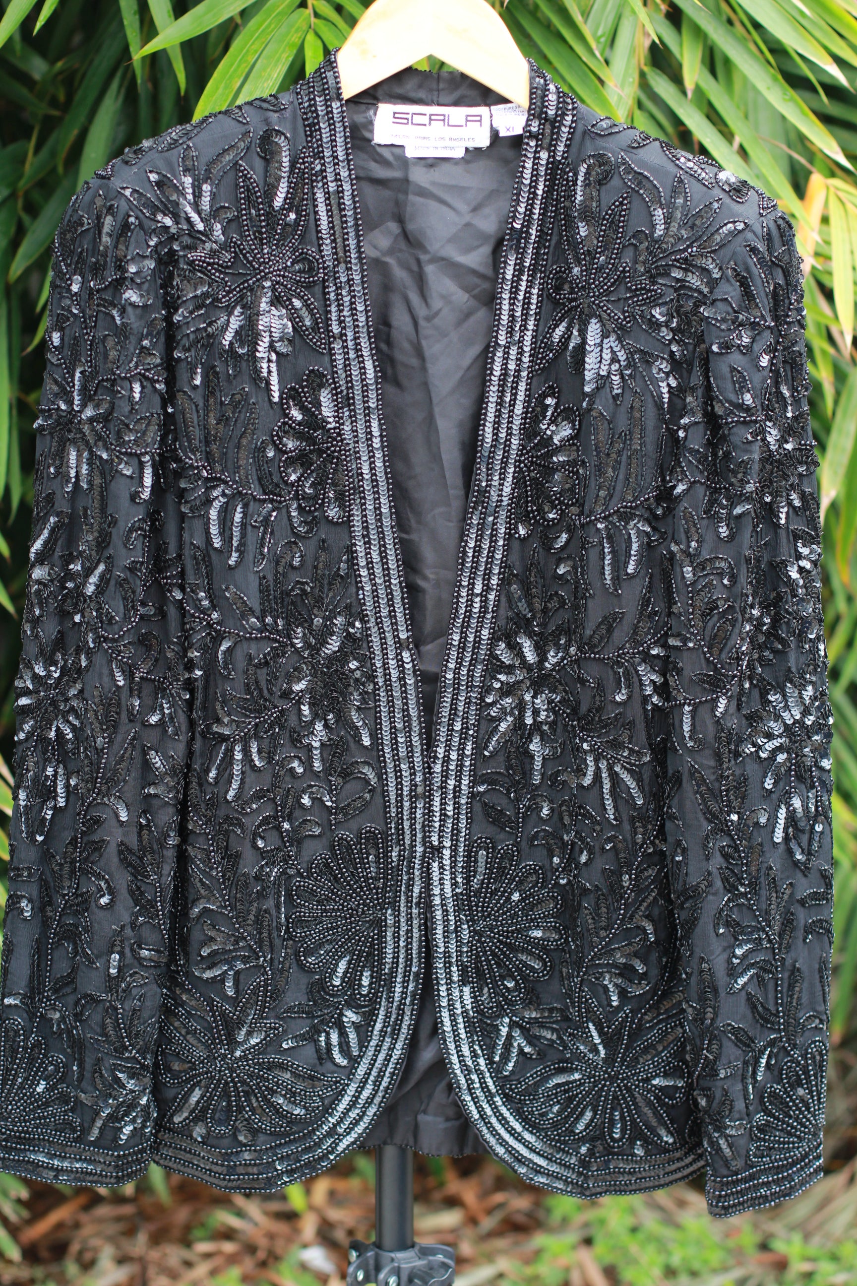 Front view of vintage Scala 1980s black beaded silk evening jacket