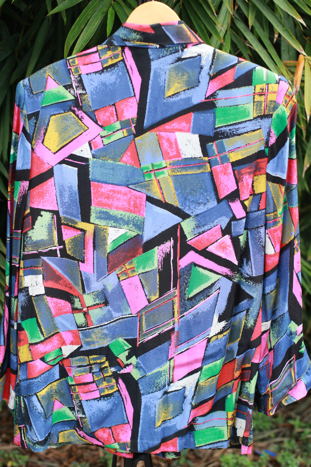 Back view showing full blazer silhouette with padded shoulders