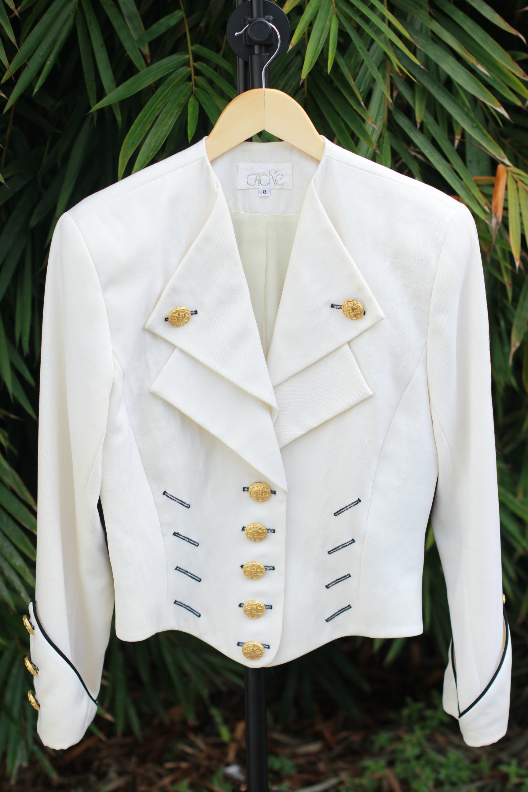 Vintage cream CACHÉ military-style wool jacket with gold buttons and black trim front view.