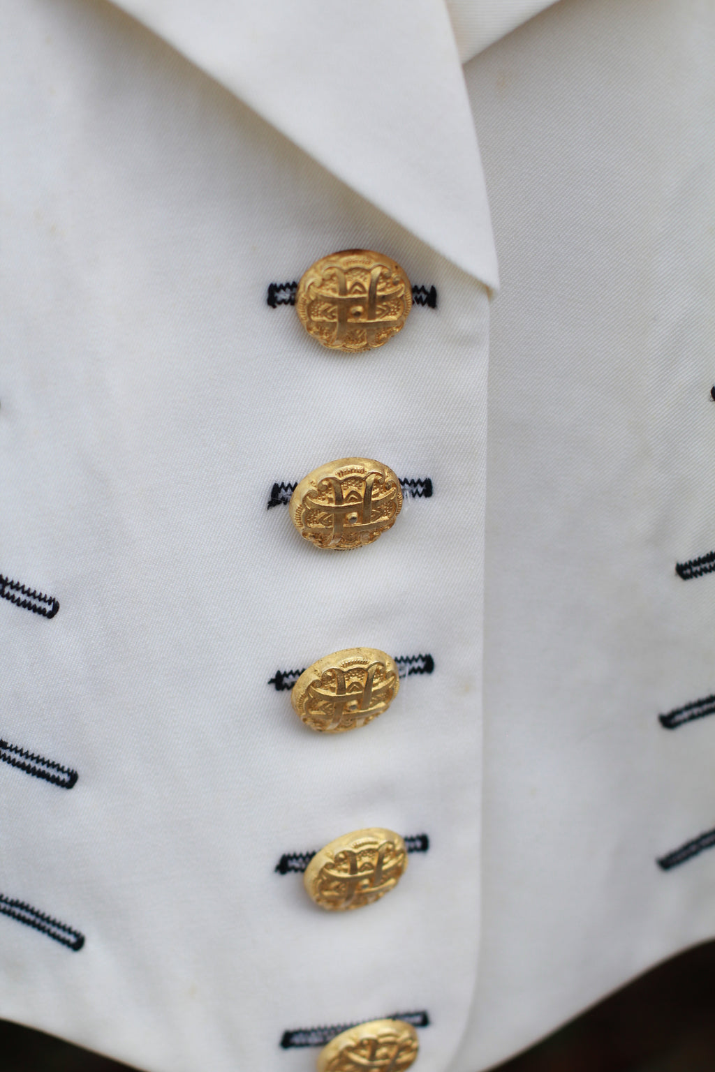 1980s cream cropped wool jacket with structured shoulders and gold-tone buttons