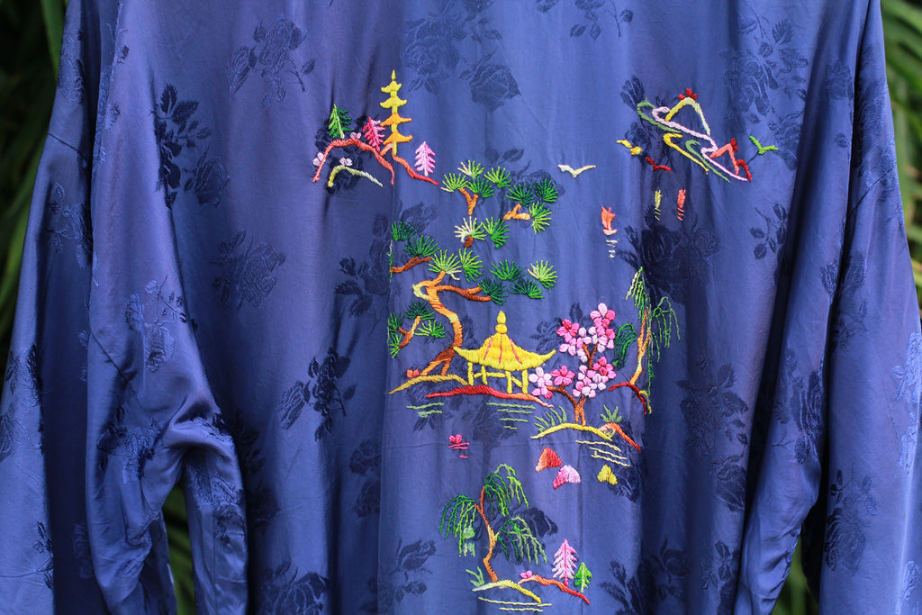 Detail of hand-stitched dragon design on back of kimono