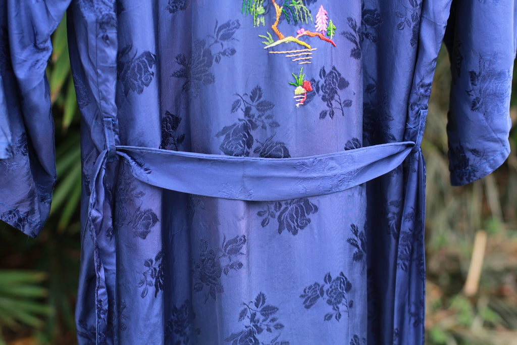 Close-up of floral jacquard fabric on vintage satin robe