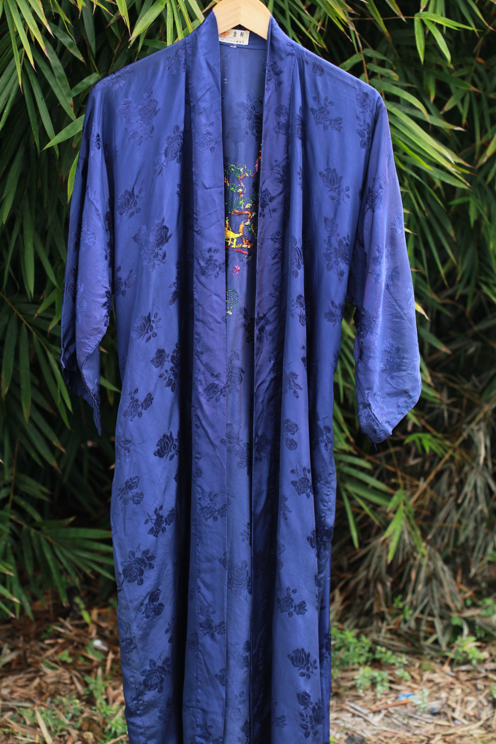 Front view of vintage Golden Dragon blue satin kimono robe with waist tie